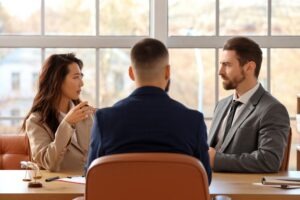 A criminal defense lawyer explains to their client that self-defense can be used in a homicide case in Arizona.