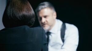A law enforcement officer interrogating a woman who understands her Miranda rights, what they actually mean, and what they don’t.