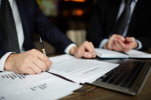 A criminal defense lawyer in Phoenix reviewing legal documents with a client.