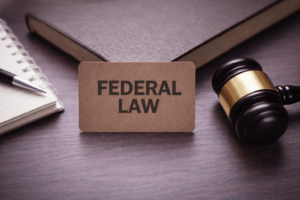 A gavel and federal law sign illustrating the federal investigation process in Tucson.