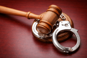 A gavel and handcuffs illustrating the court process after an arrest in Tucson