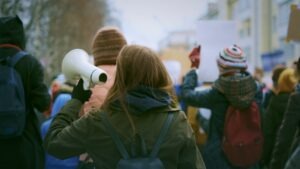 A group of people protesting to symbolize the fact that several proposed Arizona bills threaten peaceful protest and free speech. 