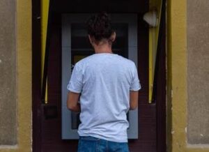 A woman visits a loved one in jail. A lawyer can tell you how to contact Watkins Jail to locate an inmate.
