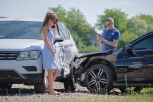 Following a car crash, a man and woman discuss what information they have to provide during a traffic stop under ARS 28-663.